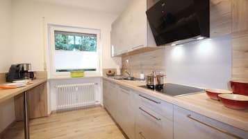 Fridge, stovetop, dishwasher, coffee/tea maker