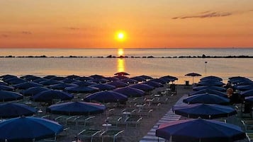 Private beach, white sand, sun-loungers, beach umbrellas