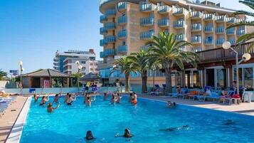 Seasonal outdoor pool, open 10:00 AM to 7:00 PM, pool umbrellas