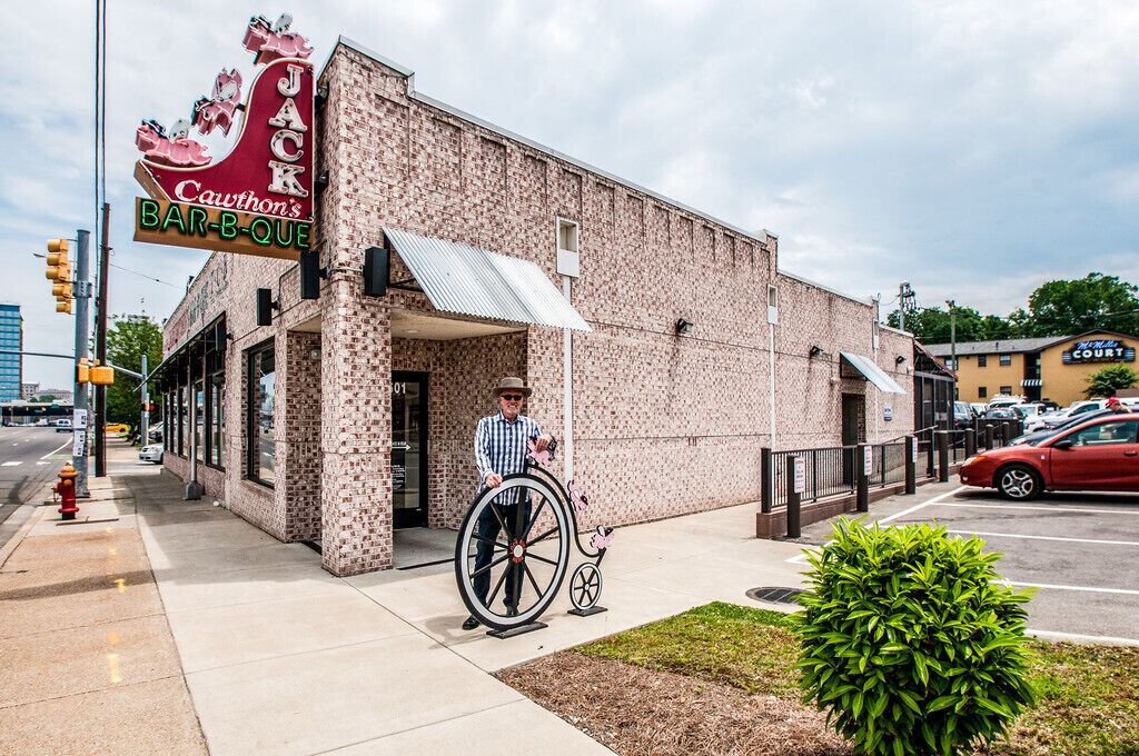 A brick building with a sign that reads "Jack Cawthon's BAR-B-QUE".