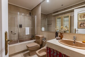 Bathtub, hair dryer, towels