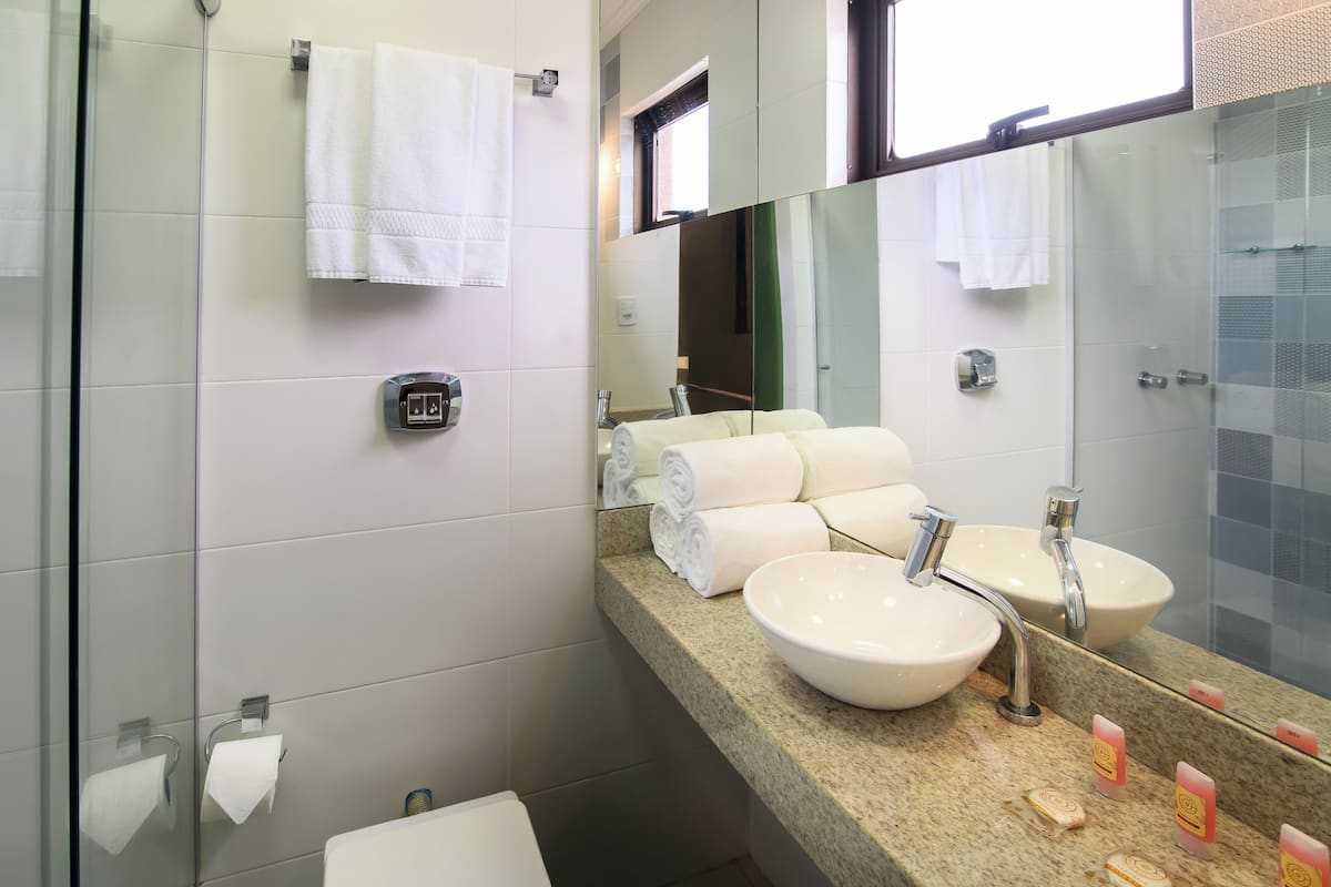superior triple room | bathroom | shower, hair dryer, towels, soap