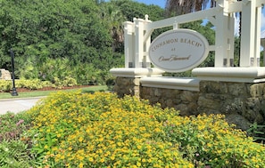 Welcome to Cinnamon Beach at Ocean Hammock, surrounded by lush greenery and vibrant flowers.