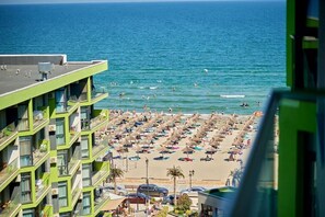 On the beach, sun loungers, beach umbrellas, 3 beach bars