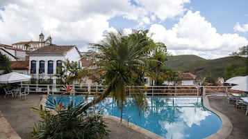 Indoor pool, pool umbrellas, pool loungers