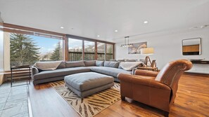 TV, fireplace, books - Refined 3BR • Ground-Level • Granite Kitchen & Vail Mountain Views (Vail)