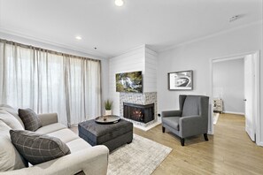 TV, fireplace - Turnkey Surf Designer, furnished Condo with amazing Amenities! (Huntington Beach)