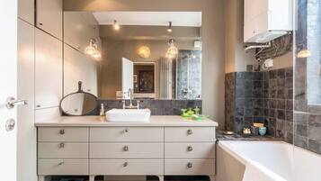 Bathtub, hair dryer, towels