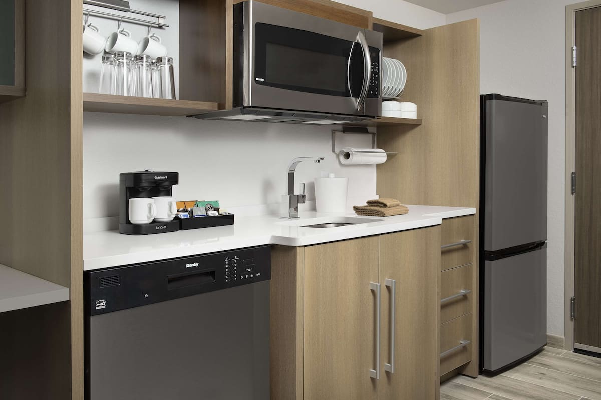 full-sized fridge, microwave, dishwasher, coffee/tea maker