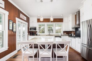 Fridge, dishwasher, coffee/tea maker, cookware/dishes/utensils