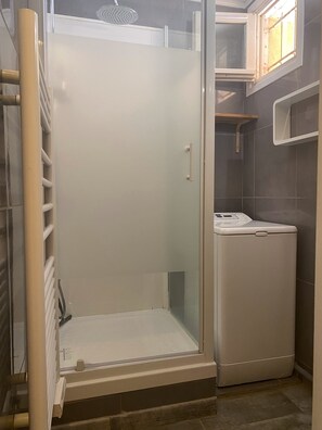 Shower, hair dryer, towels, soap