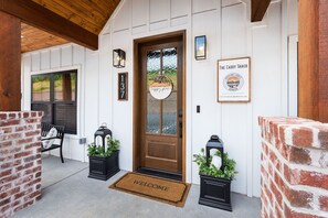 Step into the inviting entrance of The Caddy Shack, where a warm welcome awaits.