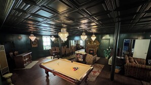 A spacious room with a pool table, a fireplace, and a dining area. - Rest & Reignite at The Pulpit House -see video-KING BED - Whole Building PRIVATE (Hagaman)