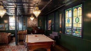 A billiards room with a pool table, green walls, and a piano. - Rest & Reignite at The Pulpit House -see video-KING BED - Whole Building PRIVATE (Hagaman)