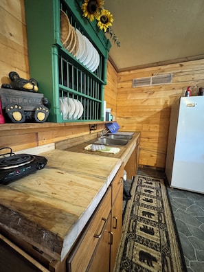 Fridge, stovetop, coffee/tea maker, cookware/dishes/utensils