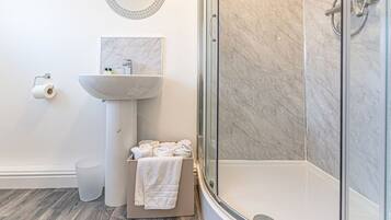 Shower, hair dryer, towels, soap
