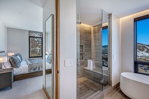Combined shower/tub, hair dryer, towels, soap