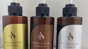 Three bottles of Darjeeling tea-based products: conditioner, shampoo, and body wash. - Kyoto Central Inn (Kyoto)