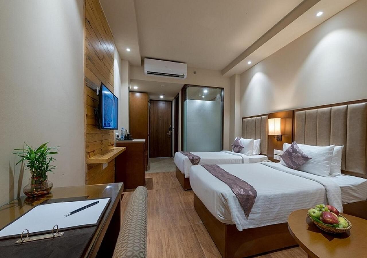 Camas Select Comfort, minibar y caja de seguridad en la habitación 