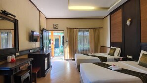 A hotel room with two beds, a desk, a television, and a view of the outdoors. - Penny Bangalow Resort (Ko Chang)