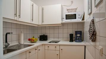 Fridge, microwave, stovetop, coffee/tea maker