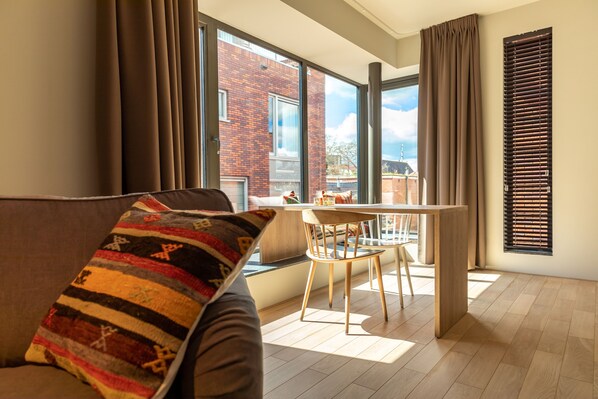 Luxury Apartment | Living area | 50-cm LCD TV with digital channels, TV, heated floors