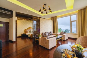 Presidential Suite | Living area | 43-inch TV with cable channels