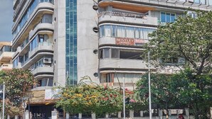 A multi-story hotel with a modern architectural design, featuring balconies and a prominent vertical glass facade. - Bentley Hotel Churchgate (Mumbai)