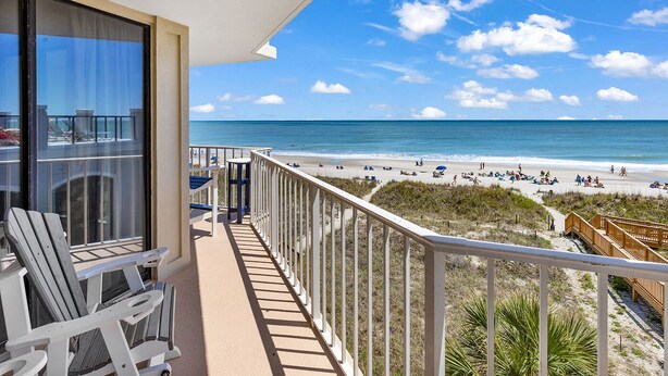 A balcony with a view of a beach and ocean. - Spectacular Atlantic Views from this Oceanfront Unit with 3 Balconies! (North Myrtle Beach)