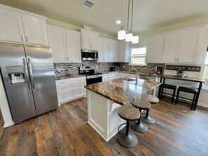 Fridge, coffee/tea maker, cookware/dishes/utensils