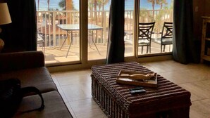 A room with a large sliding glass door leading to a balcony with a view of the beach and ocean. - SHORES OF PANAMA- 3RD FLOOR!
Perfect for a couple plus two kids in the bunkroom. (P C BEACH)