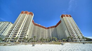 A high-rise hotel with a curved facade, multiple balconies, and a beach view. - SHORES OF PANAMA- 3RD FLOOR!
Perfect for a couple plus two kids in the bunkroom. (P C BEACH)