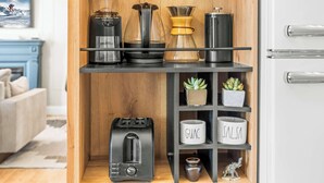 A kitchen shelf with a coffee maker, a toaster, and two labeled mugs. - Pine Street Retreat | 1BR Hot Tub Home, Dog Door, Walk to Main St | Leadville (Leadville)