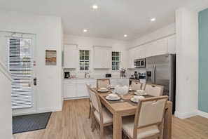 Marvelous dinning area of the apartment in Four Corners. - Beautiful window facing dinning area of the apartment - Elite 6 persons dinning - Stunningly located large windows with mesmerizing views - Majestic decored space with beautiful paintings