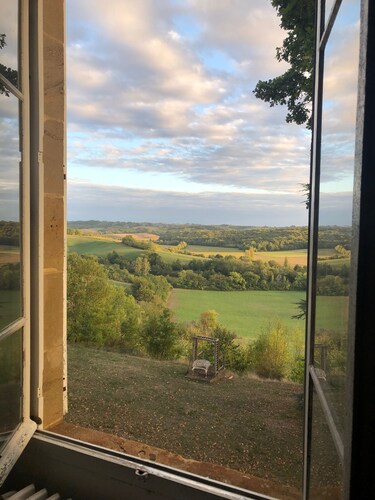 Château on a hill surrounded by its own land overlooking the countryside