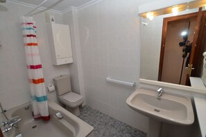 Bathtub, hair dryer, towels