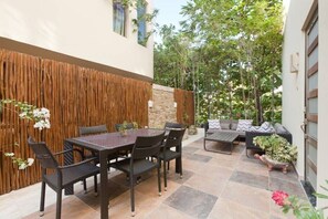 Outdoor dining - Modern Condo w/ Large Private Patio on 5th Avenue. 4 min. Walk to the Beach! (Playa del Carmen)
