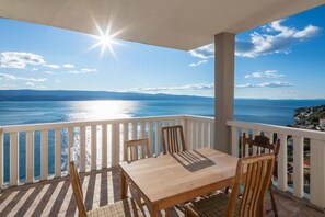 Enjoy a meal or relax on the balcony with a view of the large body of water.