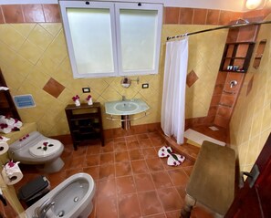 A bathroom with a toilet, bidet, sink, and shower. - Villa Sea Forever, Big Ocean View, Heart of Manuel Antonio (Quepos)