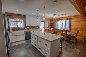 Enjoy meals in the kitchen with a central island, dishwasher, and dining area.