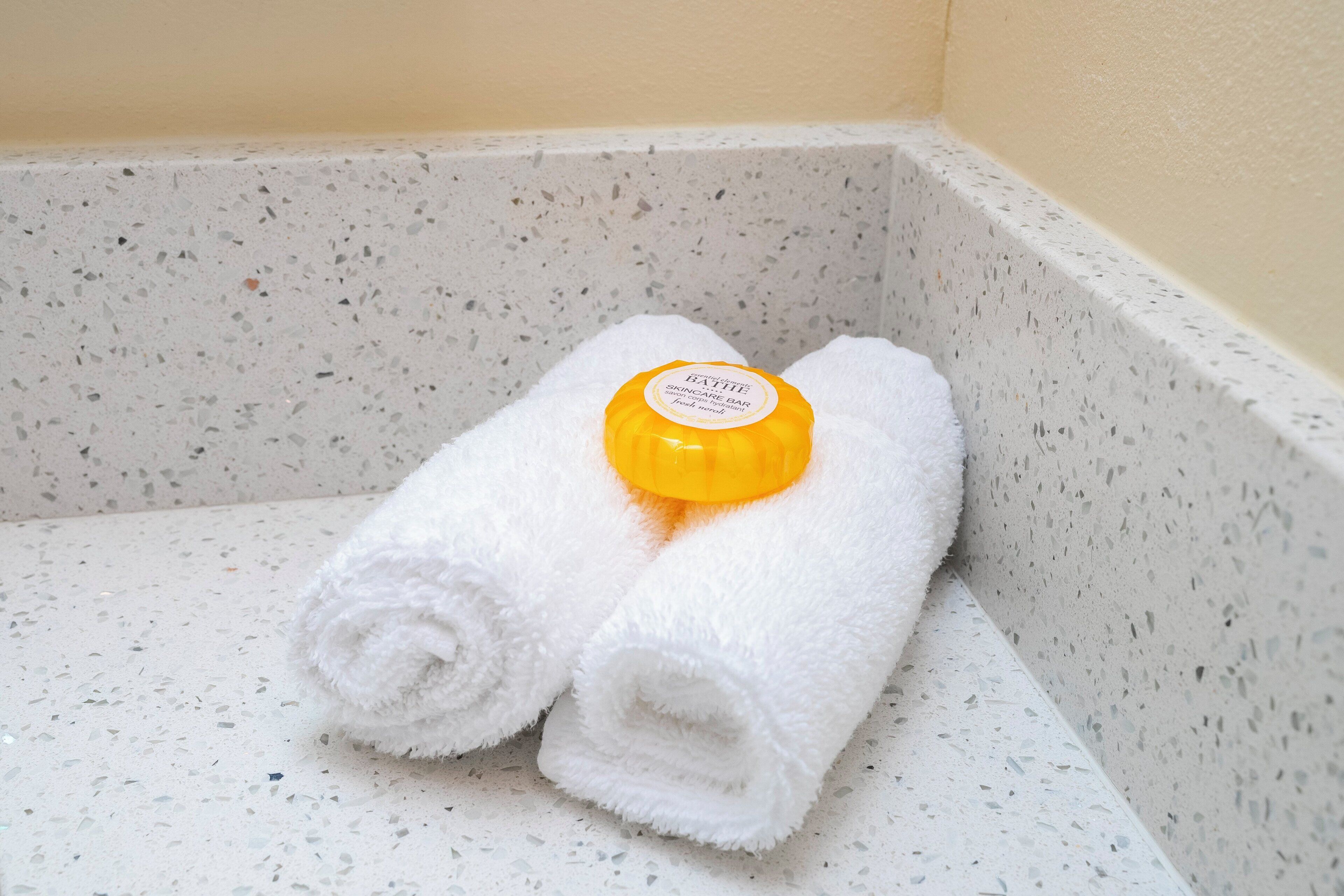 hair dryer, towels, soap, shampoo