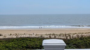 A beach view with a sandy shore, waves, and a clear sky. - Oceanfront 4BR Duplex in Bethany Beach – Panoramic Views & Private Beach Access (Fenwick Island)