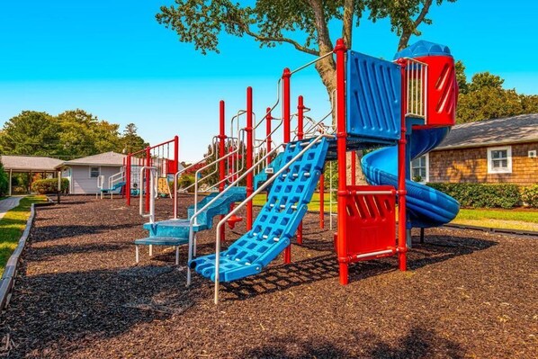 A playground with slides and climbing structures. - 511 Doral Drive - Bethany West (Bethany Beach)