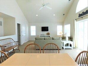 6 South Carolina Avenue - Great Room Panorama - A sweeping look at the main living floor highlights the home's impressive volume and the thoughtful placement of mirrors and windows to enhance the sense of space. The ceiling fan ensures comfort across the open-concept level.
