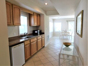6 South Carolina Avenue - Studio Kitchenette - The lower level features a convenient kitchenette with wood cabinetry and essential appliances. This functional space is perfect for preparing snacks or drinks without needing to head to the main floor.