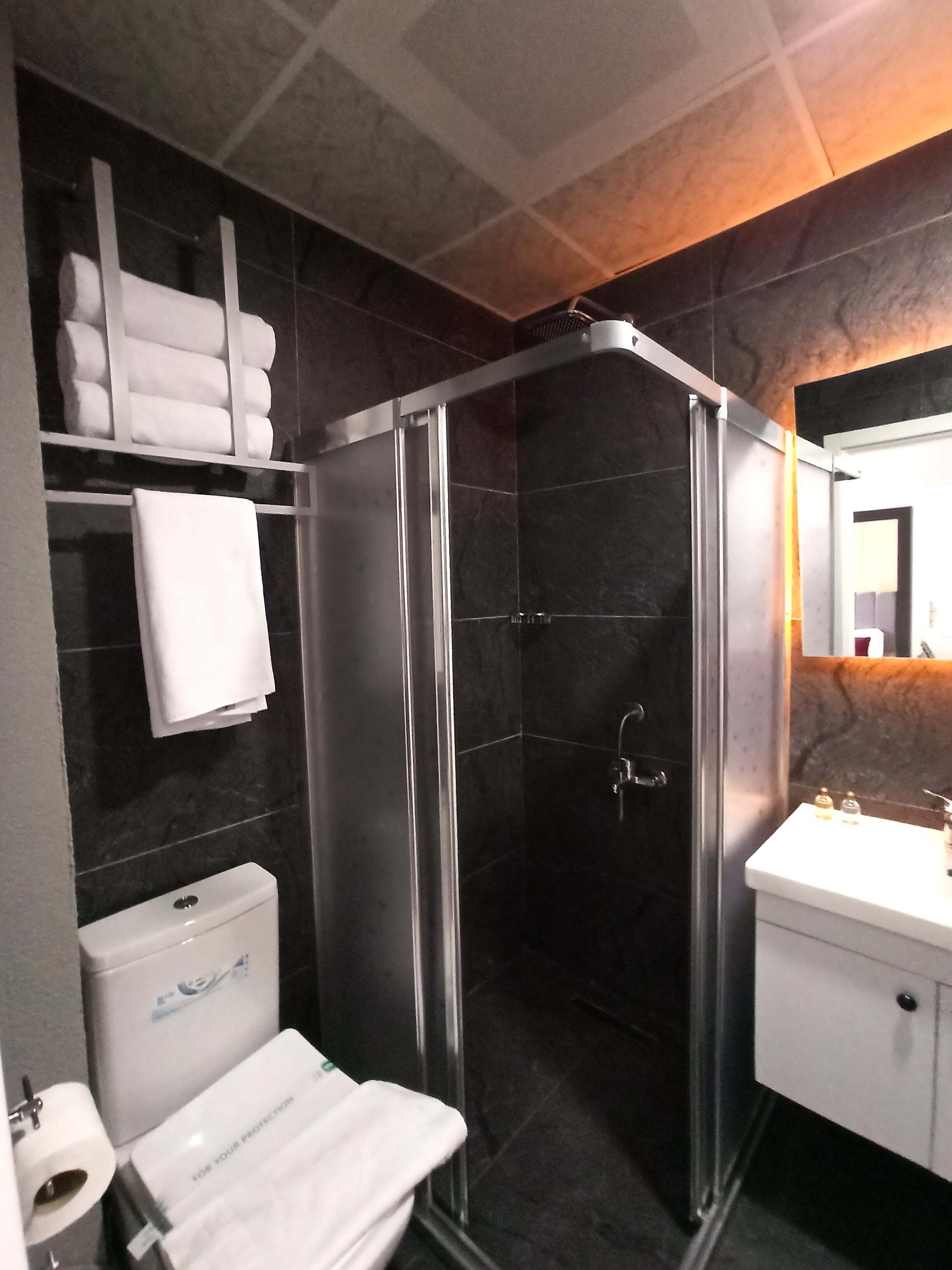 Shower, rainfall showerhead, designer toiletries, hair dryer