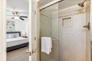 Shower, hair dryer, towels, shampoo