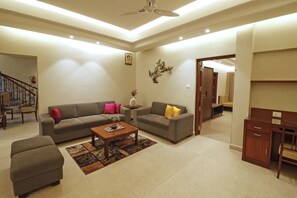 Executive Double Room, 1 King Bed | Living area | 32-inch LED TV with satellite channels, TV - Manohari The Tea Retreat (Dibrugarh)