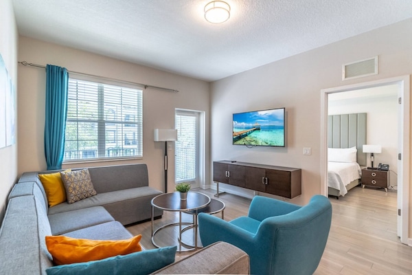 Bright and open living area with access to the private balcony and master bedroom