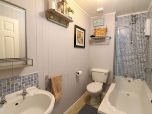A bathroom with two sinks, a toilet, a shower, and a mirror. - Harbour Reach (Weymouth)